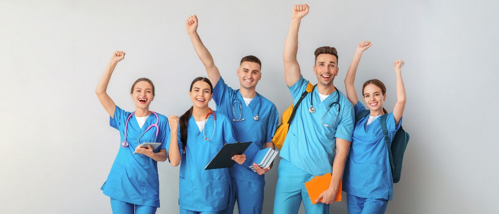 Students celebrating from online course success